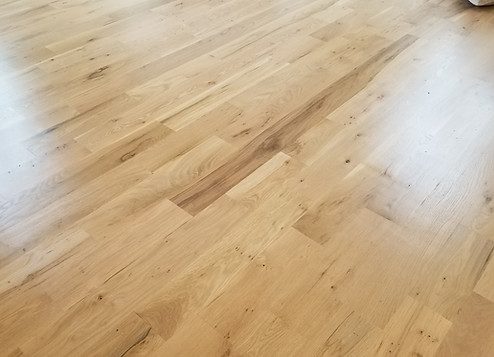 Wide plank white oak flooring close-up in an Alpharetta, GA home