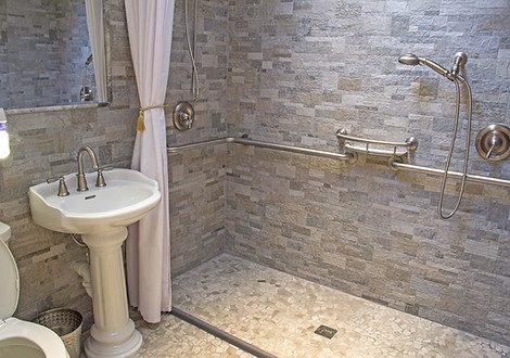 Stone tile walk-in shower installed by The Hardwood Guys