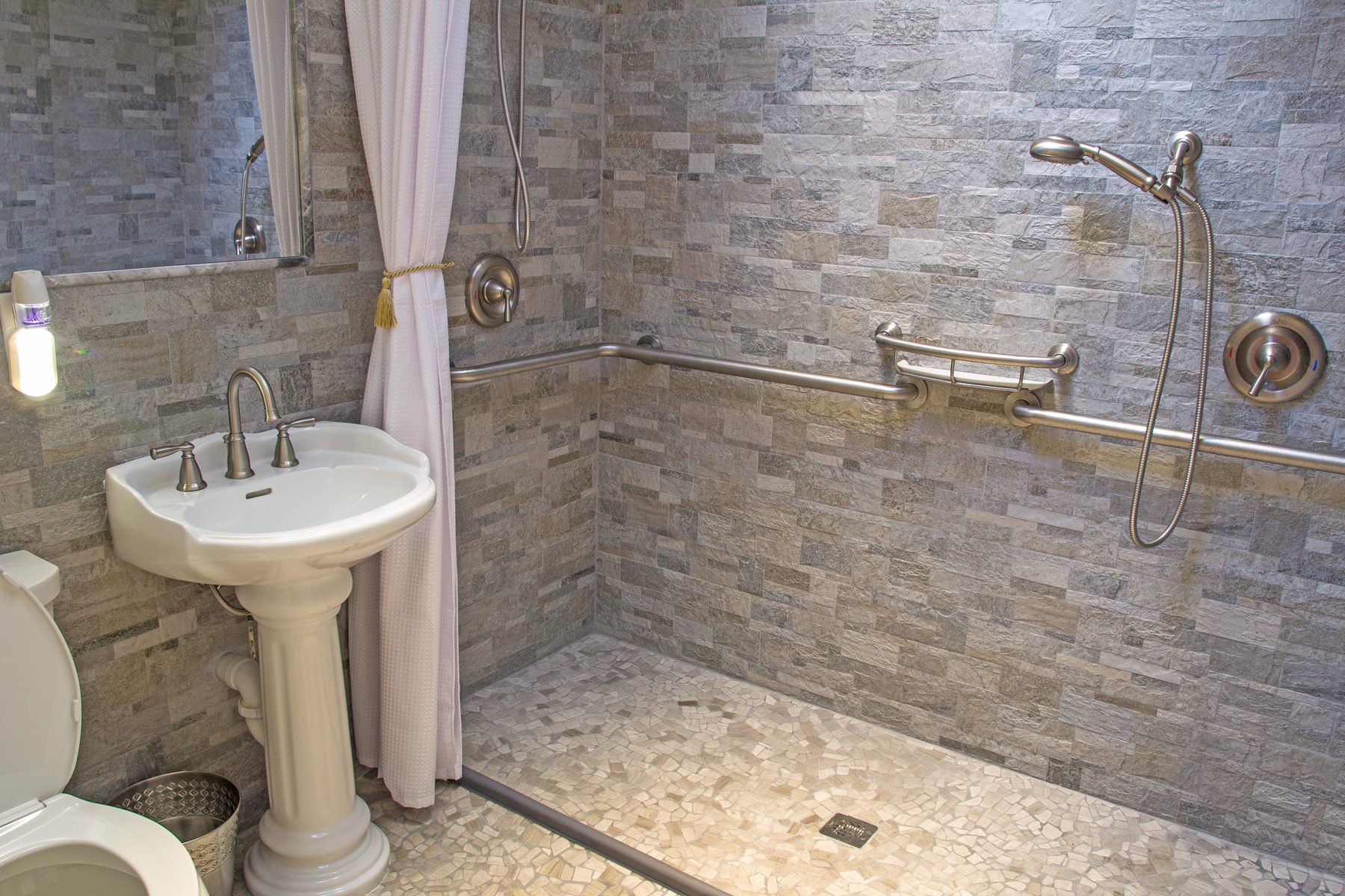 Curbless tile walk-in shower with grab bars, bathroom remodel by The Hardwood Guys