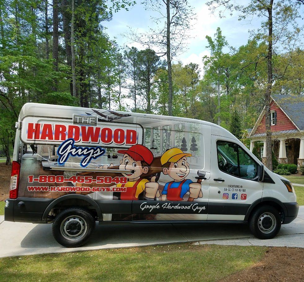 The Hardwood Guys company service van on a job site