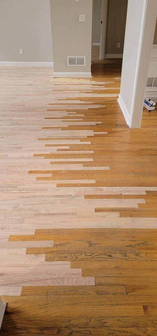 Hardwood floor lacing repair blending new boards into an existing floor in Atlanta, GA