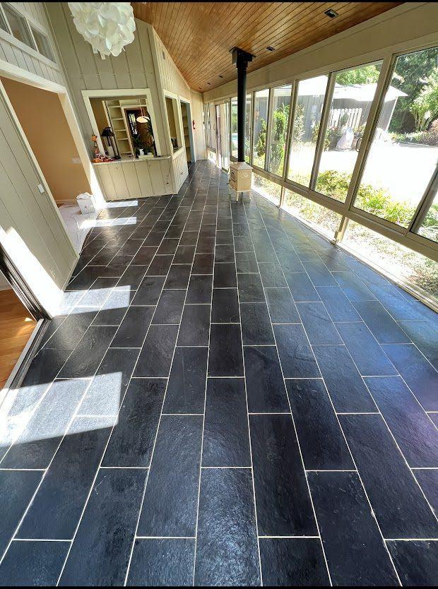 Slate tile flooring installed in a sunroom by The Hardwood Guys