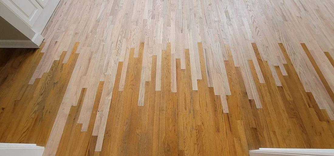 Refinished hardwood floor in an Atlanta, GA living room, finished with a satin sheen
