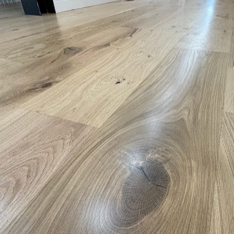 Refinished white oak hardwood floor detail in a North Atlanta home