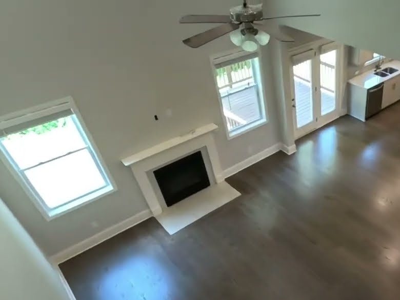 Overhead view of a gray-stained red oak floor beside a fireplace, hardwood installation in Canton, GA