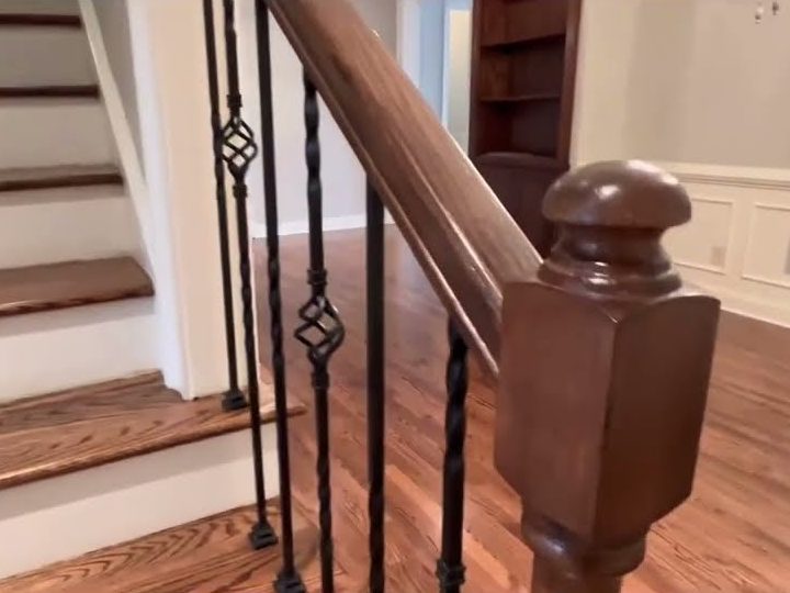 Stained red oak stair treads, newel post and floor, hardwood installation in Kennesaw, GA