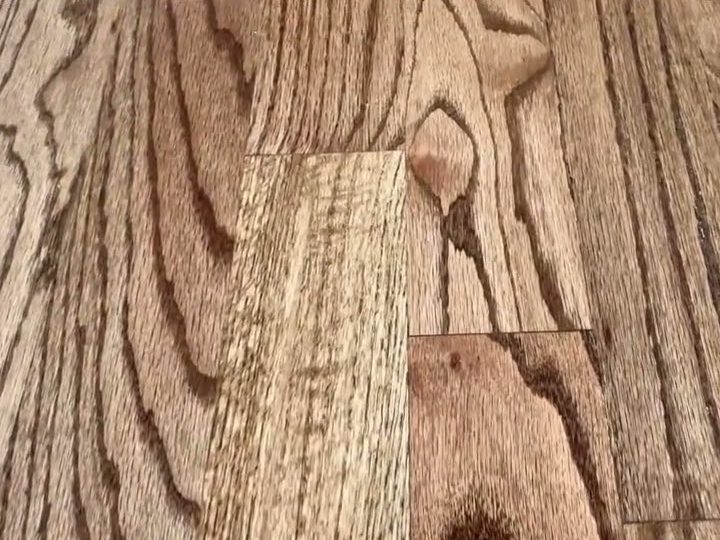Close-up of red oak floor grain with Provincial stain, hardwood installation in Kennesaw, GA