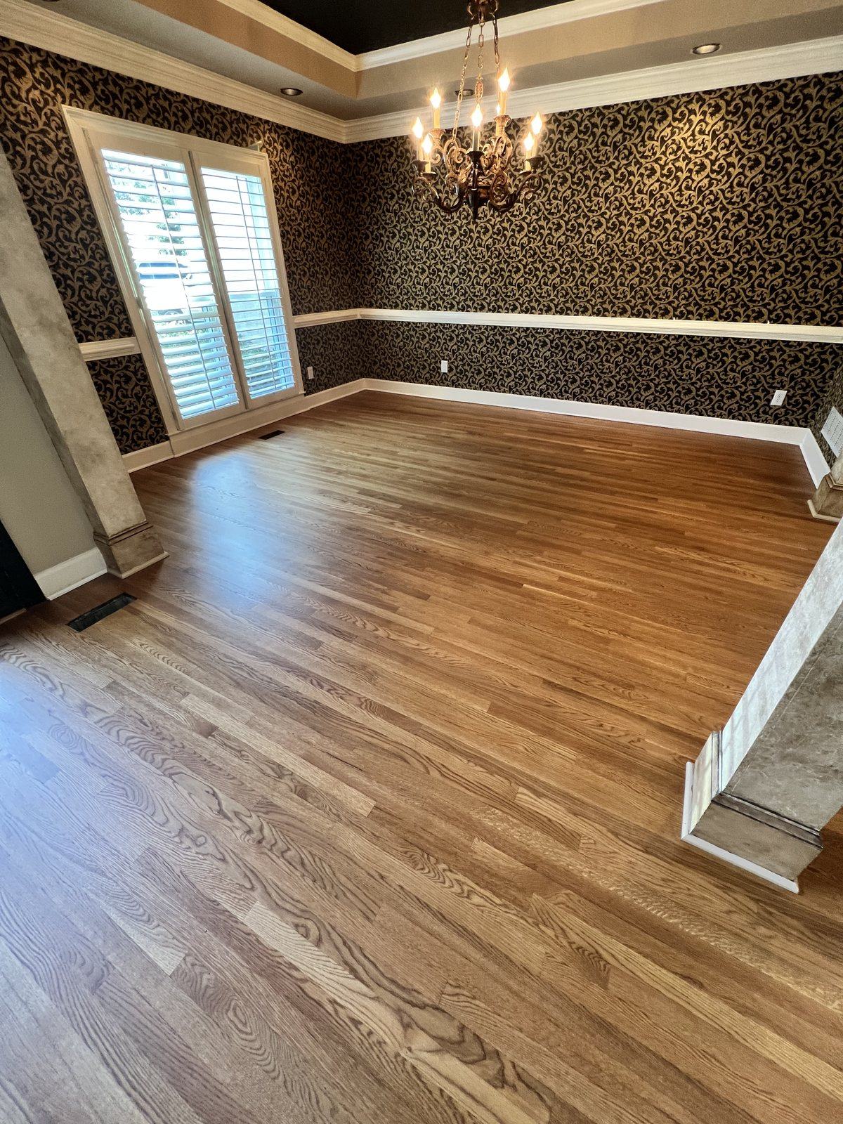 Dining room with red oak hardwood floor in Golden Oak stain and a matte finish, by The Hardwood Guys