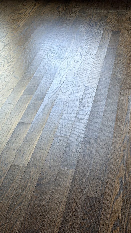 Gray-stained oak floor with a white, cloudy haze in the finish from moisture